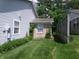 Green grass grows in the side yard of this home at 6723 S New Jersey St, Indianapolis, IN 46227