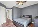 Comfortable bedroom with window, carpet flooring, and a cozy bed perfect for relaxing after a long day at 6809 Amber Springs Way, Indianapolis, IN 46237