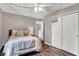 Cozy bedroom with a large window, string lights, closet, and carpet flooring, perfect for relaxing at 6809 Amber Springs Way, Indianapolis, IN 46237