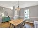 Bright dining room featuring modern lighting and stylish accents at 6809 Amber Springs Way, Indianapolis, IN 46237