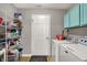 Laundry room with washer, dryer, shelving and hanging storage space at 6809 Amber Springs Way, Indianapolis, IN 46237