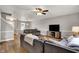 Bright living room with hardwood floors, two sofas, and a ceiling fan at 6809 Amber Springs Way, Indianapolis, IN 46237