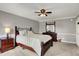 Comfortable main bedroom features carpet, light gray walls and matching dark wood furniture at 6809 Amber Springs Way, Indianapolis, IN 46237