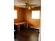Bedroom featuring hardwood floors, two windows offering great natural light, and ceiling fan at 706 Bobs Ct, Beech Grove, IN 46107