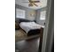 Cozy bedroom featuring wood floors, two windows, and a simple yet inviting decor at 706 Bobs Ct, Beech Grove, IN 46107