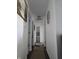 Bright hallway featuring dark wood floors and white walls, creating a clean, modern look at 706 Bobs Ct, Beech Grove, IN 46107