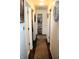 Bright hallway with hardwood floors and white trim at 706 Bobs Ct, Beech Grove, IN 46107