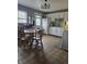 Charming eat-in kitchen featuring tile flooring, white cabinets, and a view to the backyard at 706 Bobs Ct, Beech Grove, IN 46107