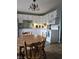 Well-equipped eat-in kitchen boasting tile floors and a full suite of white appliances at 706 Bobs Ct, Beech Grove, IN 46107
