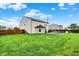 Spacious, fenced backyard featuring an in-ground pool and plenty of green grass at 714 Thornburg Pkwy, Brownsburg, IN 46112