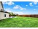 View of the backyard, showcasing the pool and the expansive lawn at 714 Thornburg Pkwy, Brownsburg, IN 46112
