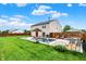 Spacious backyard featuring an in-ground pool, lawn, and wood fence at 714 Thornburg Pkwy, Brownsburg, IN 46112