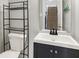 Updated powder room with new vanity and mirror at 714 Thornburg Pkwy, Brownsburg, IN 46112