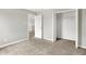 Bedroom featuring gray walls, carpet floors, and closet at 714 Thornburg Pkwy, Brownsburg, IN 46112