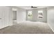 Bedroom featuring gray walls, carpet floors, ceiling fan, and double window to let in natural light at 714 Thornburg Pkwy, Brownsburg, IN 46112