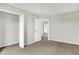 The carpeted bedroom provides access to another room at 714 Thornburg Pkwy, Brownsburg, IN 46112