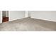 This carpeted bedroom offers access to other rooms at 714 Thornburg Pkwy, Brownsburg, IN 46112