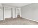 Bedroom featuring gray walls, carpet floors, and an open closet ready for storage at 714 Thornburg Pkwy, Brownsburg, IN 46112