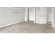 Bedroom featuring gray walls, carpet floors, and closet with storage shelving at 714 Thornburg Pkwy, Brownsburg, IN 46112