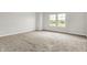 This carpeted bedroom offers bright windows providing natural light at 714 Thornburg Pkwy, Brownsburg, IN 46112