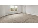 This carpeted bedroom offers a bright window providing natural light at 714 Thornburg Pkwy, Brownsburg, IN 46112
