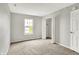 The carpeted bedroom features a closet and a window providing outdoor views at 714 Thornburg Pkwy, Brownsburg, IN 46112