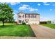 Charming two-story home features a well-manicured lawn, a two-car garage, and lovely curb appeal at 714 Thornburg Pkwy, Brownsburg, IN 46112
