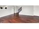 Hallway with Wood-look flooring, staircase and doorway at 714 Thornburg Pkwy, Brownsburg, IN 46112