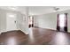 Spacious living room featuring sleek hardwood floors and plenty of natural light at 714 Thornburg Pkwy, Brownsburg, IN 46112