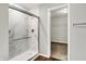 Modern shower featuring frameless glass doors and marble tile surround at 714 Thornburg Pkwy, Brownsburg, IN 46112