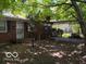 Welcoming brick home featuring a covered carport and a neatly kept front yard at 7141 E 48Th St, Indianapolis, IN 46226