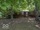 Cozy brick home with mature trees and a well-maintained front yard at 7141 E 48Th St, Indianapolis, IN 46226
