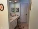 Hall bathroom with an extended vanity, classic tile and a neutral color palette at 7440 Sylvan Ridge Rd, Indianapolis, IN 46240