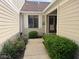 Inviting front entrance with stone pathway and well-manicured garden at 7440 Sylvan Ridge Rd, Indianapolis, IN 46240