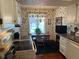 Bright eat-in kitchen featuring a dining table and ample natural light at 7440 Sylvan Ridge Rd, Indianapolis, IN 46240