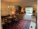 Spacious living and dining area featuring a fireplace and elegant decor, perfect for entertaining at 7440 Sylvan Ridge Rd, Indianapolis, IN 46240