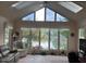 Bright sunroom with large windows offering serene lake views, creating a peaceful retreat at 7440 Sylvan Ridge Rd, Indianapolis, IN 46240