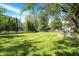 The property has a generous backyard, wooden fences, mature trees and privacy at 7587 Winding Way, Fishers, IN 46038