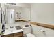 Accessible bathroom featuring a vanity, toilet, and handrails for added convenience and safety at 7587 Winding Way, Fishers, IN 46038