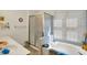 Bathroom features a separate shower and tub, providing options for relaxation and cleanliness at 7587 Winding Way, Fishers, IN 46038