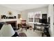 Cozy living room with a fireplace, comfortable seating, and a bright window, perfect for relaxing at 7587 Winding Way, Fishers, IN 46038