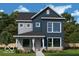 Charming two-story home featuring blue and gray siding and a welcoming front porch at 786 James William Ln, Westfield, IN 46074