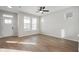 Spacious living room featuring hardwood floors, neutral walls, and lots of natural light from many windows at 786 James William Ln, Westfield, IN 46074