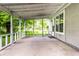 This back porch has a concrete floor overlooking the backyard at 9118 Hardwood Ct, Indianapolis, IN 46250
