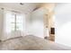 Bright bedroom features updated carpets, a window, and leads into bathroom at 9118 Hardwood Ct, Indianapolis, IN 46250