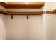 This walk-in closet features wood shelving and ample storage space at 9118 Hardwood Ct, Indianapolis, IN 46250