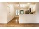 Bright kitchen offers white cabinetry, stainless steel appliances, open floorplan at 9118 Hardwood Ct, Indianapolis, IN 46250