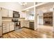 Open concept kitchen flows into living area with fireplace and plenty of space to move around at 9118 Hardwood Ct, Indianapolis, IN 46250