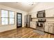 Bright kitchen with white cabinets, stainless steel appliances, and natural light, a welcoming cooking space at 9118 Hardwood Ct, Indianapolis, IN 46250