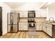 Updated kitchen with stainless steel appliances, white cabinets and plenty of space at 9118 Hardwood Ct, Indianapolis, IN 46250